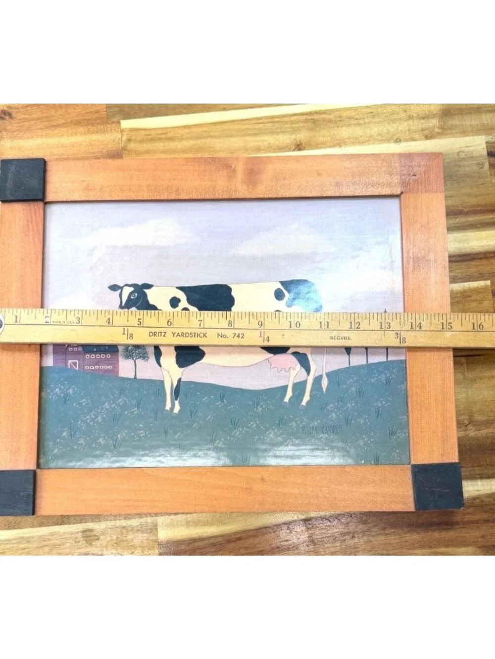 Framed folk art print, American rural scene, Holstein cow